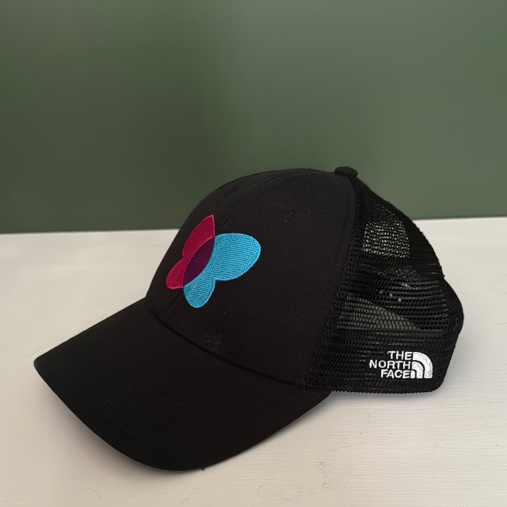 The North Face Black hat with mesh panels and blue & pink butterfly design
